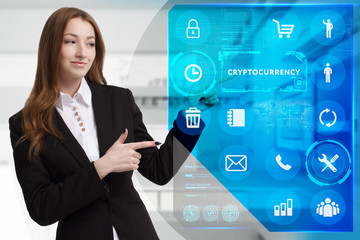 Business, Technology, Internet and network concept. Young businessman working on a virtual screen of the future and sees the inscription: Cryptocurrency