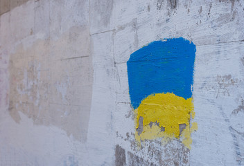 The Ukrainian flag is paited on the wall.