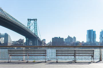 Two Benches at a Park on the Lower East Side in New York City along the East River and the Williamsburg Bridge