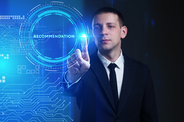Business, Technology, Internet and network concept. Young businessman working on a virtual screen of the future and sees the inscription: Recommendation