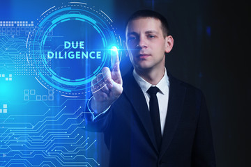 Business, Technology, Internet and network concept. Young businessman working on a virtual screen of the future and sees the inscription: Due diligence