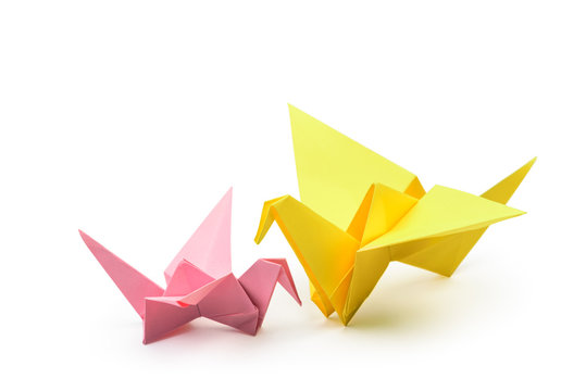 Pair of Origami birds, child and adult isolated with clipping path.