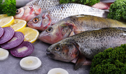 Different sorts of fish on kitchen table