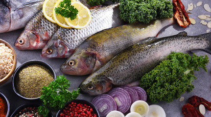 Different sorts of fish on kitchen table