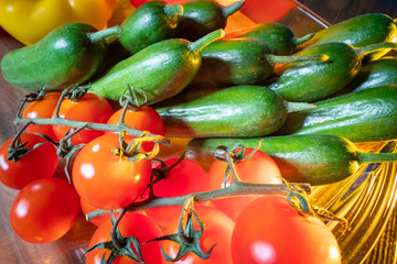 Cucumbers and tomatoes closeup. Vegetables on the menu. Salad of fresh vegetables. Vegetarianism. Healthy diet. Culinary background. Cooking with fresh vegetables.