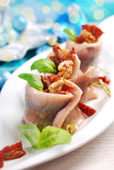 herring rolls with dried tomato and walnuts