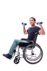 Obraz premium Young disabled man doing physical exercises isolated on white