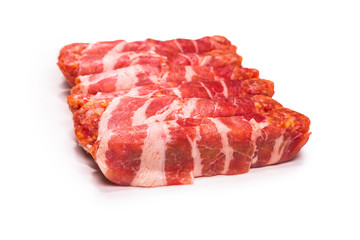 Chevapchichi in bacon isolated on white background.