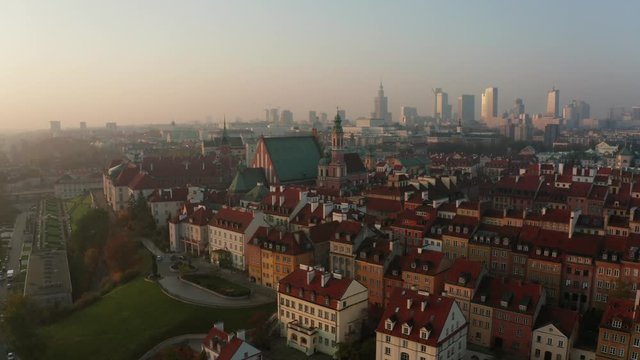 Drone flight over the old city in Warsaw at sunrise. Drone flies over the historic center of Warsaw, Poland.