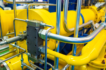Gas pipeline close up. Methane supply to the enterprise. Gasification of an industrial enterprise. Chrome pipes. Yellow pipeline. Point is gas control. Equipment for gas supply systems.