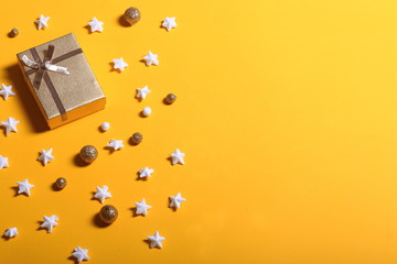 Gift box and stars on yellow background