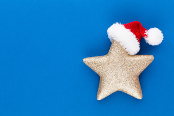 Fototapeta na wymiar Christmas star, decor on pastel colored background. Christmas or New Year minimal concept.