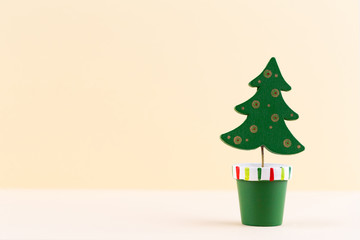 Christmas tree on pastel colored background. Christmas or New Year minimal concept.