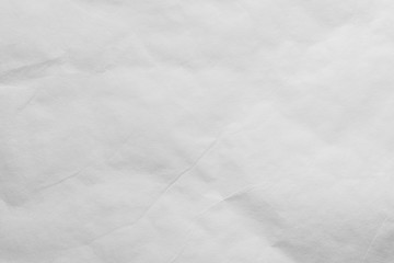 A white sheet of paper with slight bends.