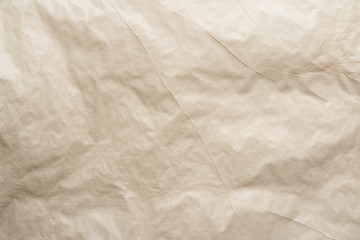 A yellow sheet of paper with slight bends.