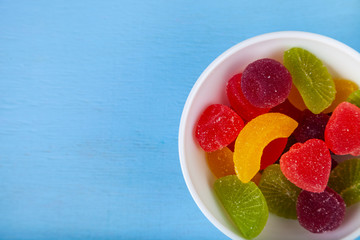 Multicolored marmalade in a bowl