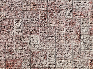 New stone wall background with rough irregular texture bricks or tiles