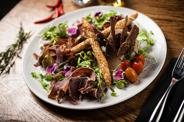 Meat platter for two served on a plate in restaurant
