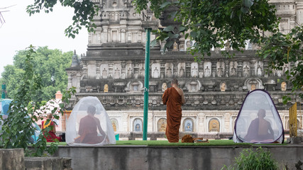 Monk praying in a quite peaceful place.