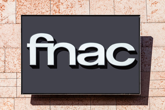 Almada, Portugal - October 24, 2019: Signboard advertising the Fnac, a books, electronics and technology store in a shopping center or shopping mall exterior wall.
