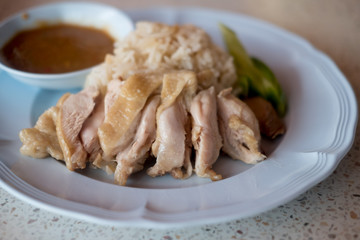 Hainanese chicken rice or steam chicken rice with sauce