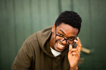 Close up handsome young african american man with glasses smiling