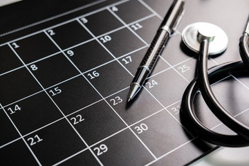 Stethoscope with calendar, medical appointment and annual checkup concept