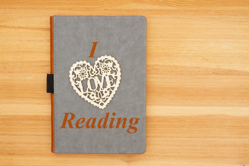 I love reading message with gray leather book with heart