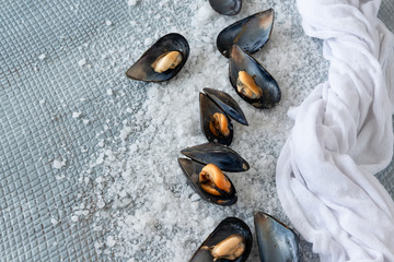 Cooked delicious black mussel, salty white background. Healthy eating concept, rich protein  food