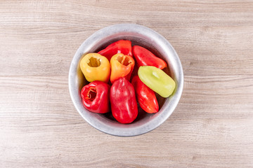 Peeled peppers placed in a bowl for further stuffing