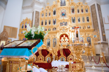 Russian church. Bride and groom in the church during the Christian wedding ceremony.