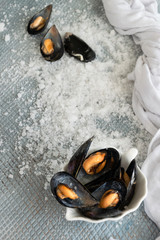 Cooked delicious black mussel, salty white background. Healthy eating concept, rich protein  food