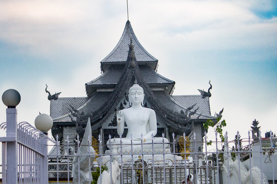 A pagoda in bodhgaya with a white statue of lord buddha.