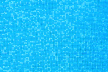 blue clear water of swimming pool with mosaic bottom