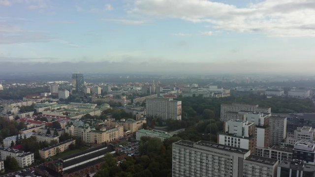 Warsaw. Poland.  Aerial view of glass skyscrapers and buildings in the business center of Warsaw. Drone whistled on modern skyscrapers and buildings on a foggy morning.