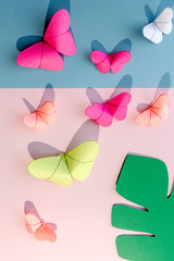 Fototapeta na wymiar Multi-colored origami butterflies from above