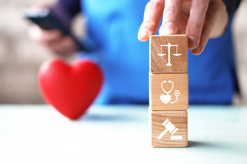Doctor hand arranging wood block stacking with icon  justice healthcare Labor Law Lawyer Legal...