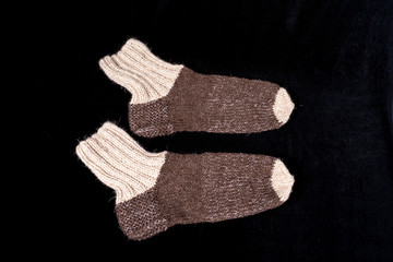 Socks knitted from wool thread on spokes by hand