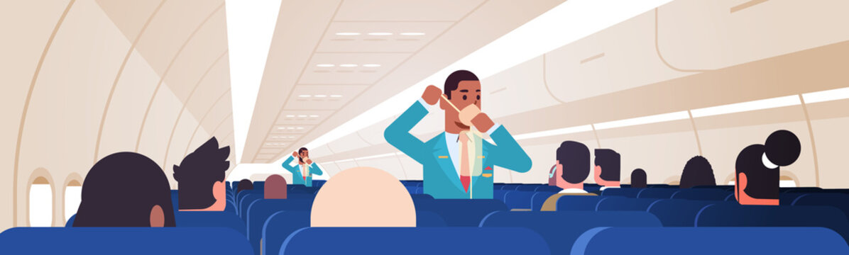 steward explaining for passengers how to use oxygen mask in emergency situation african american male flight attendants safety demonstration concept modern airplane board interior horizontal vector