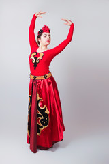 Dancing Armenian girl in a red dress