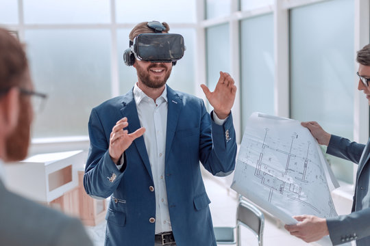 architect using virtual reality glasses in the workplace.