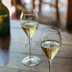 Flutes filled with sparkling Prosecco, in a restaurant in Valdobbiadene. Prosecco is a white...