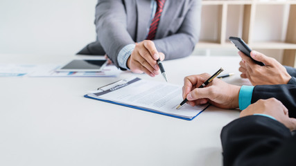 Business people sign financial business contract.