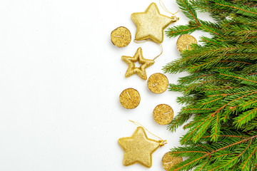 Golden candles and  stars gold colors  with green Christmas tree branches on white background. Copy space