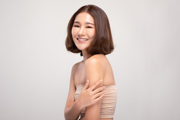 Fototapeta na wymiar Side view of Beautiful Asian woman with short hair smile with clean and fresh skin Happiness and cheerful with positive emotional,isolated on white background,Beauty and Cosmetics Concept