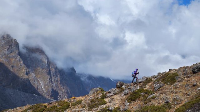Active hiker hiking next to mount Everest 
