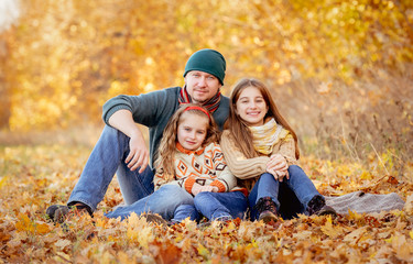 Fototapeta premium Sitting in autumn leaves