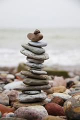 stack of pebbles on the beach closeup