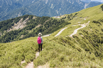 Naklejka na ściany i meble Asian mountain climbing woman walking