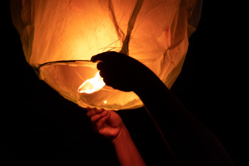 flying lantern in hand